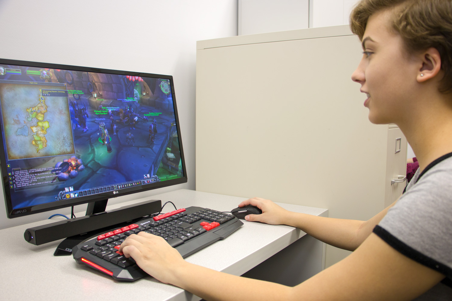 student playing a computer game in the game lab